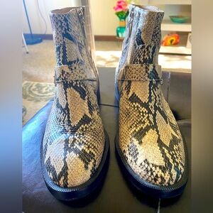 Schutz woman’s snake skin look booties